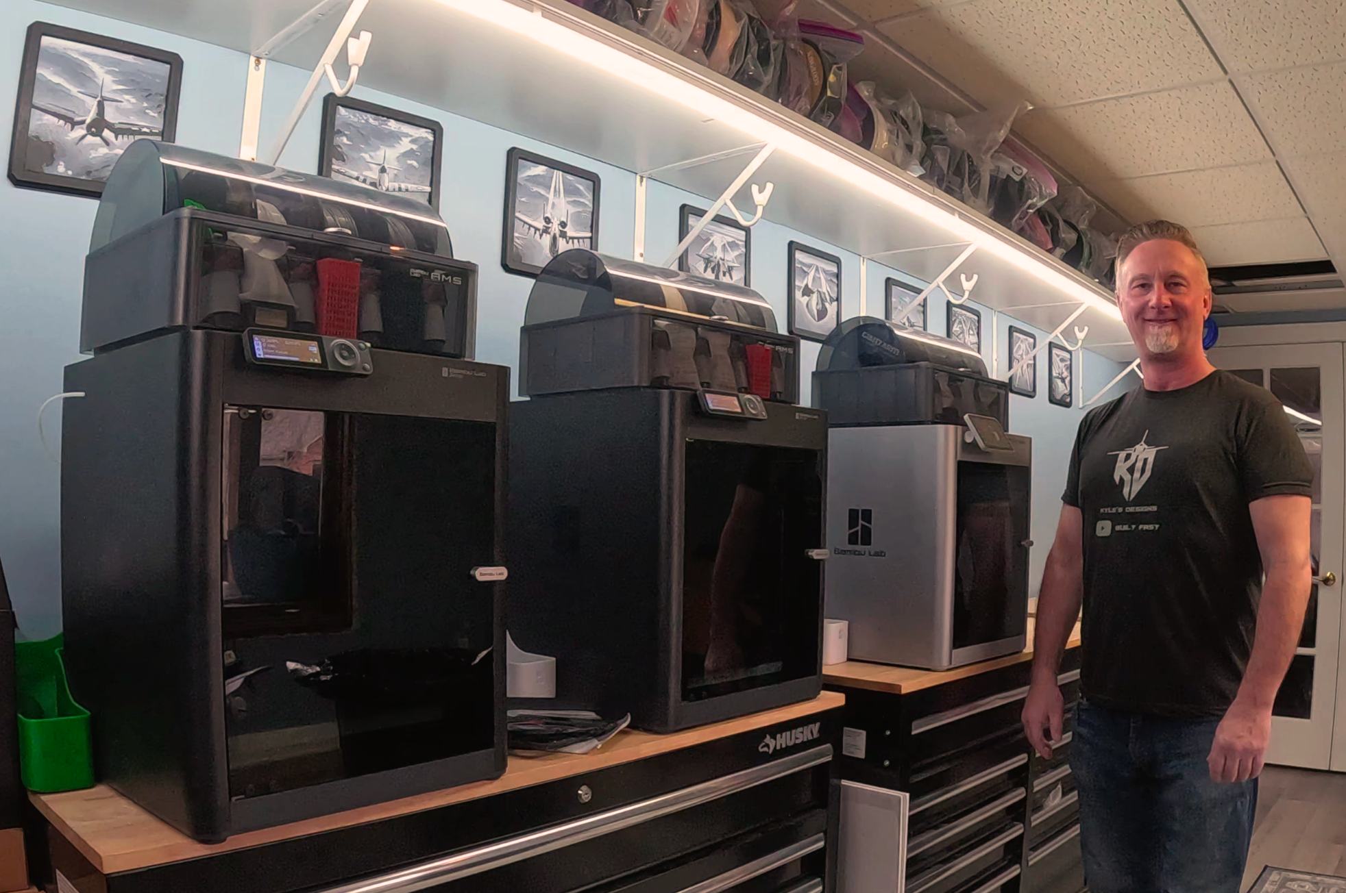 Chris with 3 bambu lab printers